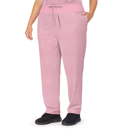 Cameo Pink Heather;Model is wearing size 1X. She is 5’9.5”, Bust 43”, Waist 37”, Hips 49.5”.@A lady wearing pink heather scrub classic pant plus.