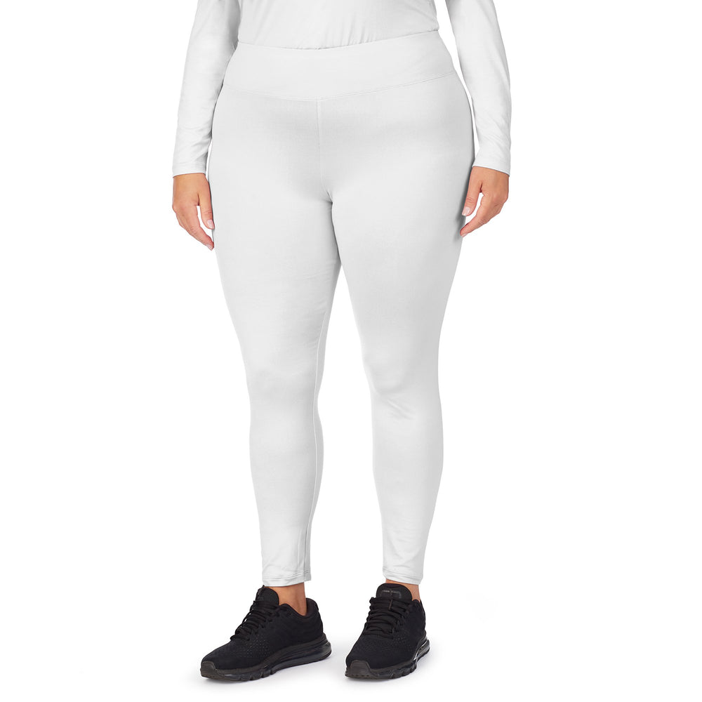 A lady wearing White underscrub legging plus.