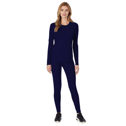 Navy;Model is wearing size S. She is 5’9”, Bust 32”, Waist 23", Hips 34.5”.@A lady wearing a navy long sleeve underscrub crew neck top.