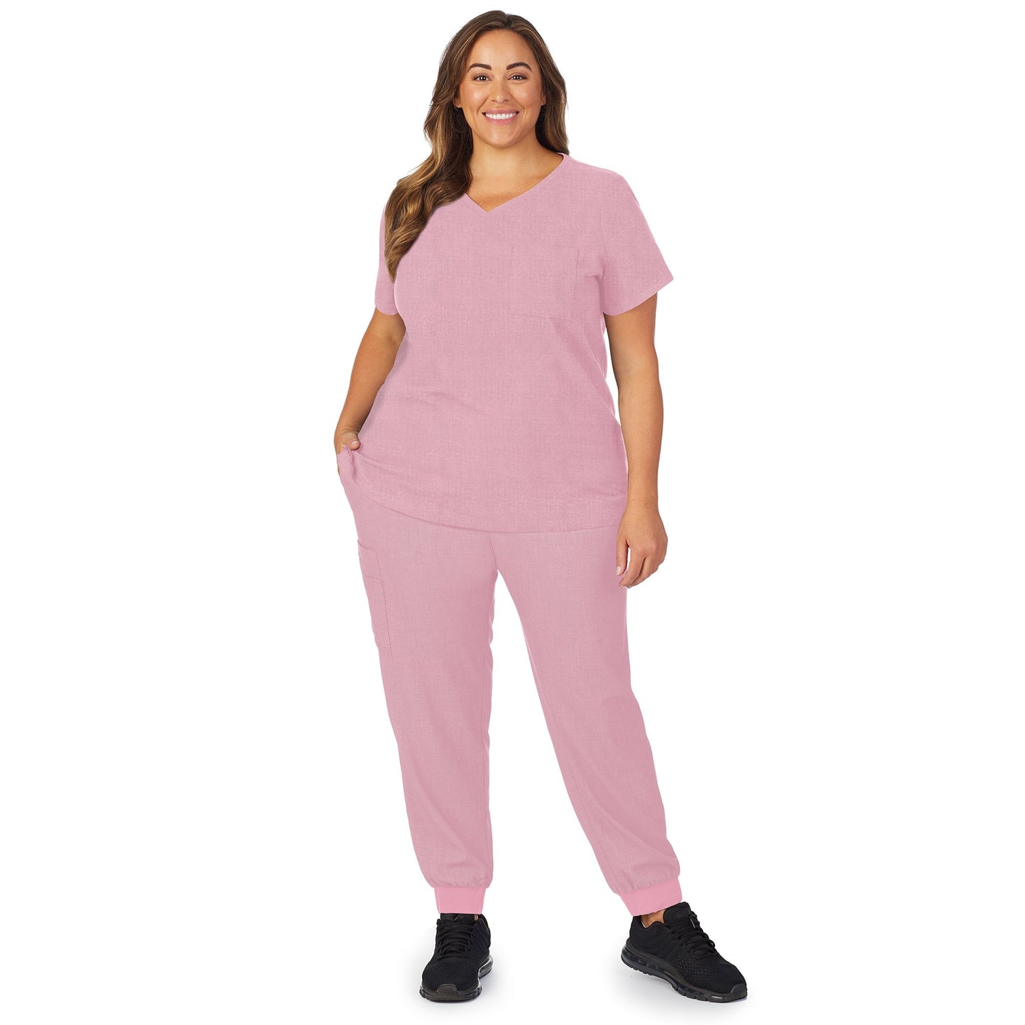 Cameo Pink Heather;Model is wearing size 1X. She is 5’9.5”, Bust 43”, Waist 37”, Hips 49.5”.@A lady wearing pink cameo heather scrub v-neck top with chest pocket plus.