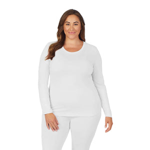 A lady wearing white long sleeve underscrub crew neck top plus.