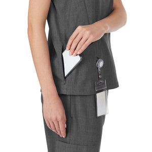A lady wearing charcoal heather scrub v-neck top with side pockets.