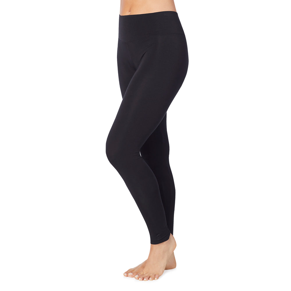 A lady wearing black high waist legging petite.