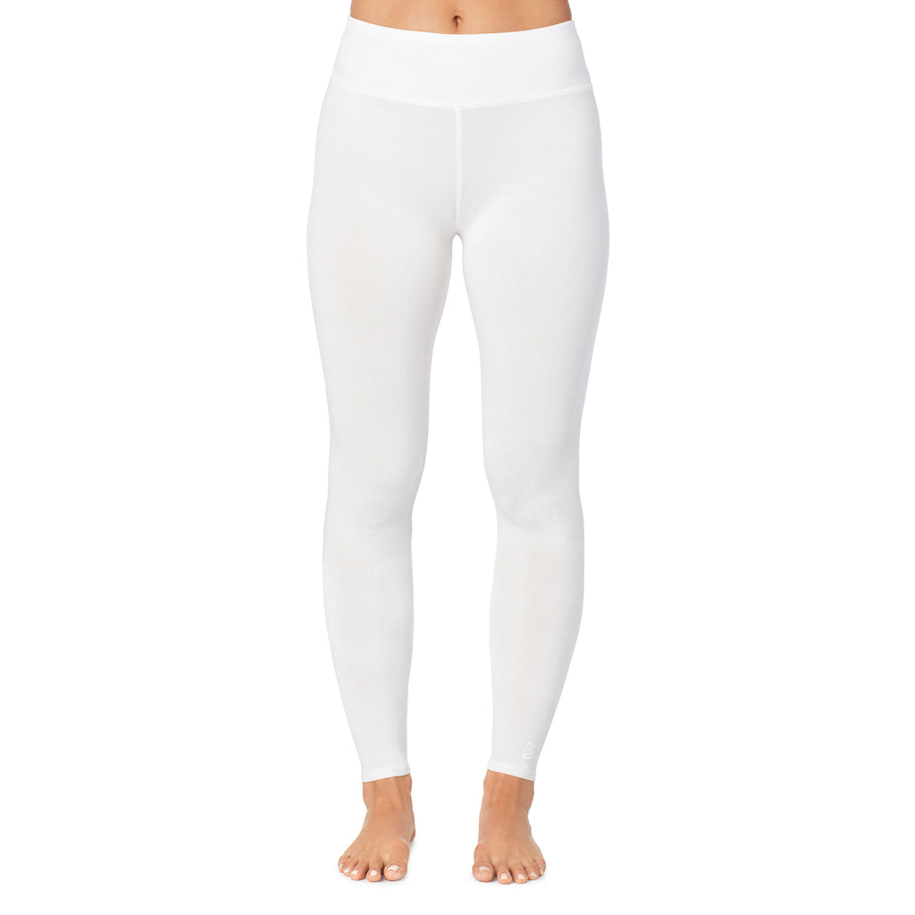 A lady wearing ivory high waist legging petite.
