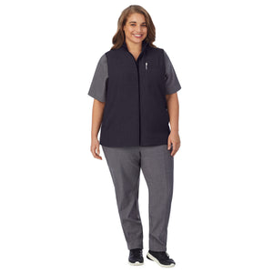 A lady wearing black scrub vest plus.