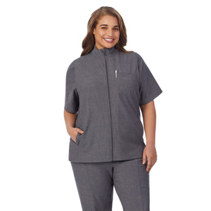  A lady wearing charcoal heather scrub vest plus.