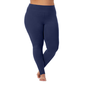 A lady wearing a dress blue high waist legging plus.