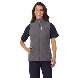  A lady wearing charcoal heather scrub vest.