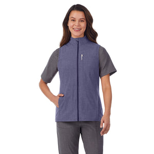  A lady wearing navy heather scrub vest.
