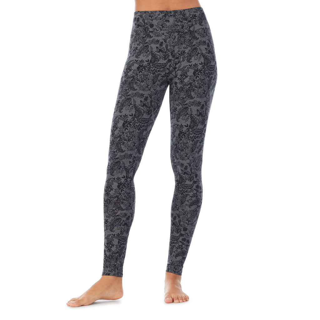 A lady wearing a heather grey paisley high waist legging.