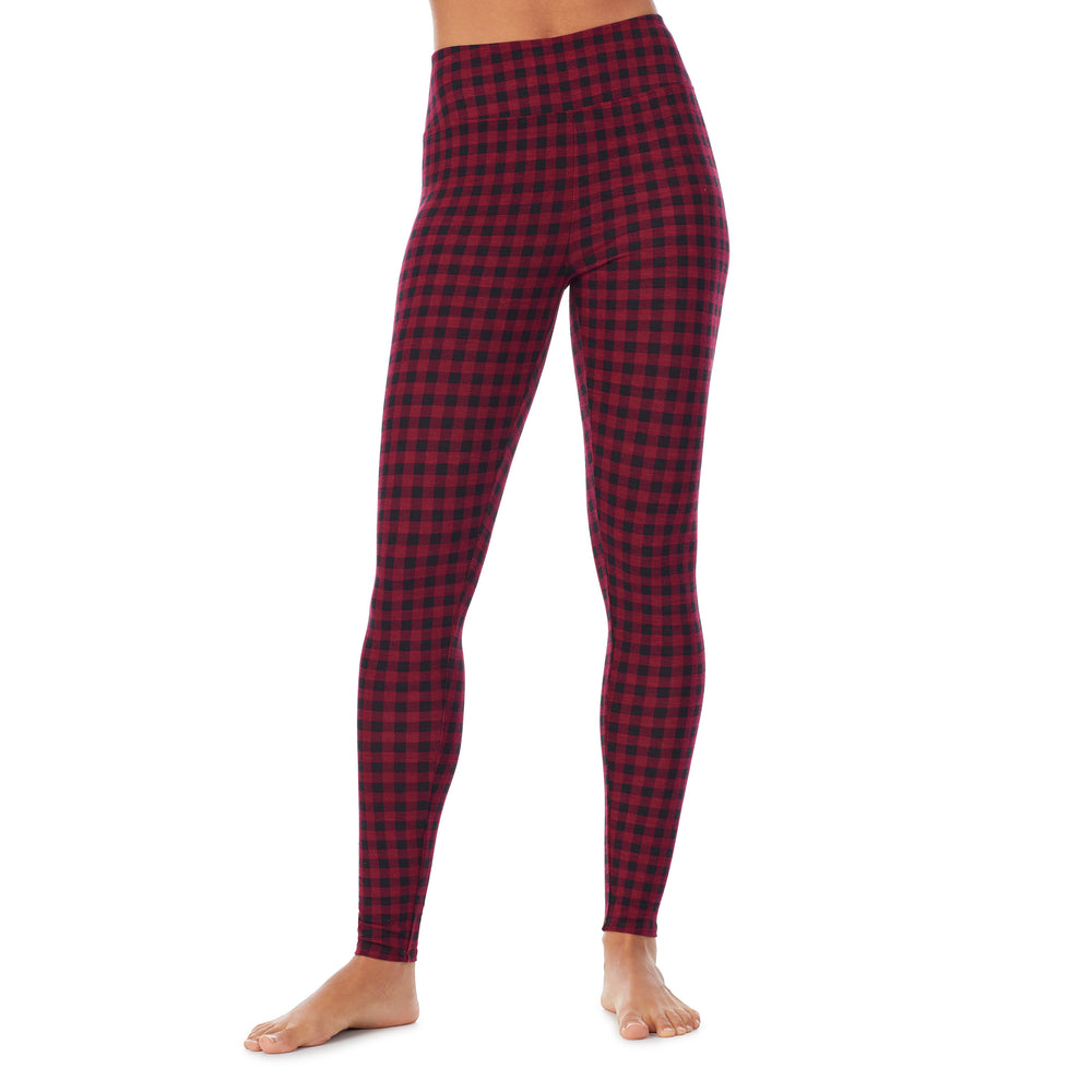 A lady wearing a red buffalo high waist legging.