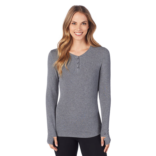 A lady wearing a charcoal heather ribbed long sleeve henley.