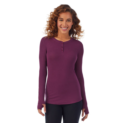  Grape; Model is wearing size S. She is 5’9”, Bust 34”, Waist 23”, Hips 35”. @A lady wearing a grape ribbed long sleeve henley.