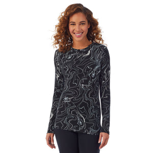 A lady wearing a black marble long sleeve stretch crew PETITE.