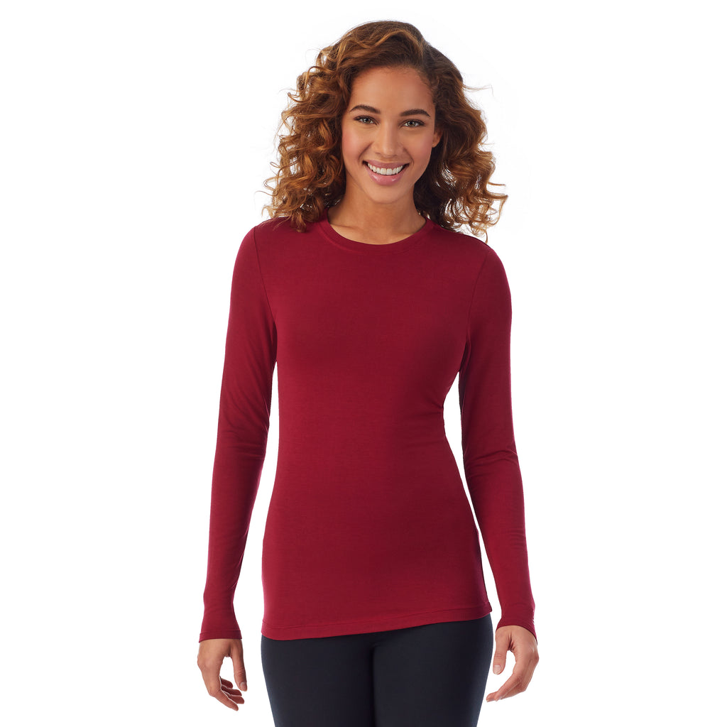 A lady wearing a rhubarb long sleeve stretch crew PETITE.