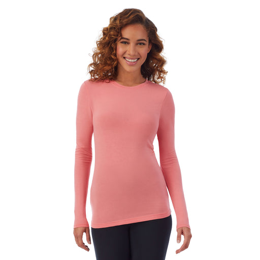 Bright Coral; Model is wearing size S. She is 5’9”, Bust 34”, Waist 23”, Hips 35”. @A lady wearing a bright coral long sleeve stretch crew PETITE.