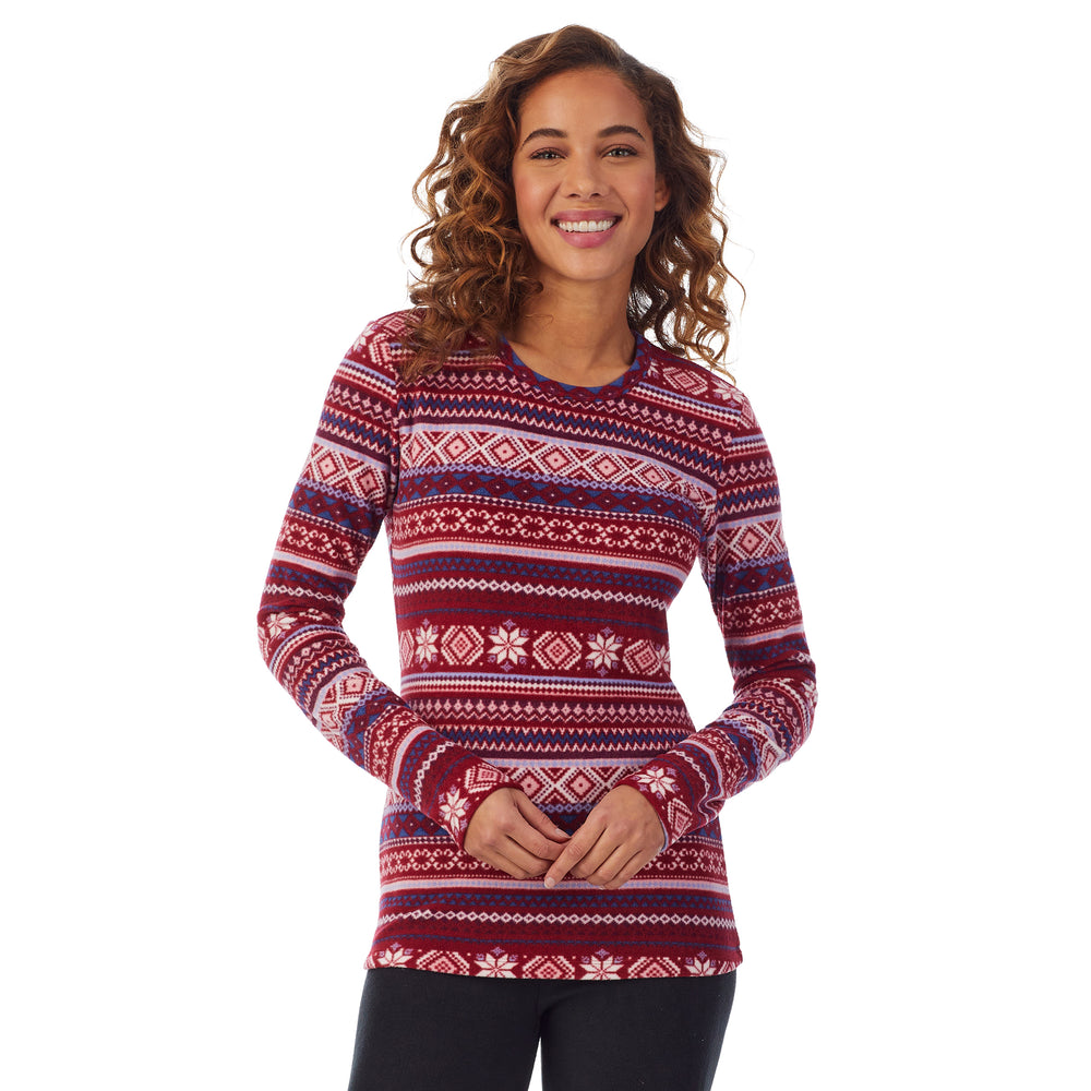 Upper body of a lady wearing red fairisle long sleeve crew
