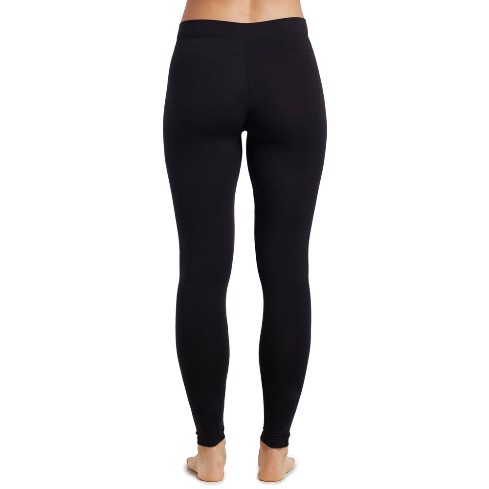 A lady wearing a black stretch legging petite.