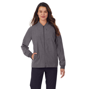 A lady wearing grey scrub jacket