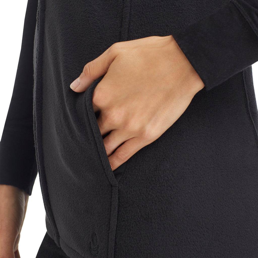 upper body of A lady wearing black full zip vest !59% Polyester, 35% Recycled Polyester, 6% Spandex!