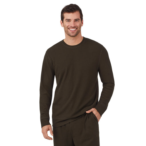 A man wearing a olive waffle thermal relaxed crew..