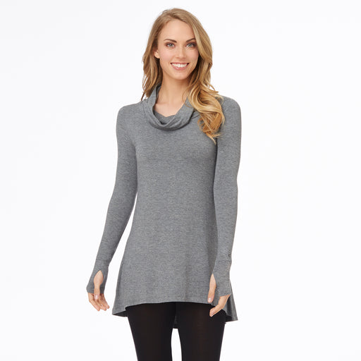 A lady wearing a charcoal heather long sleeve stretch cowl tunic. 