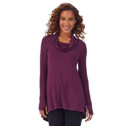 Grape; Model is wearing size S. She is 5’9”, Bust 34”, Waist 23”, Hips 35”. @A lady wearing a grape long sleeve stretch cowl tunic.