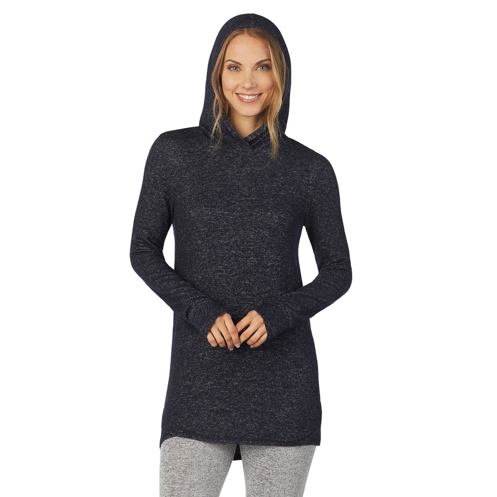 A lady wearing a marled dark charcoal long sleeve tunic hoodie.