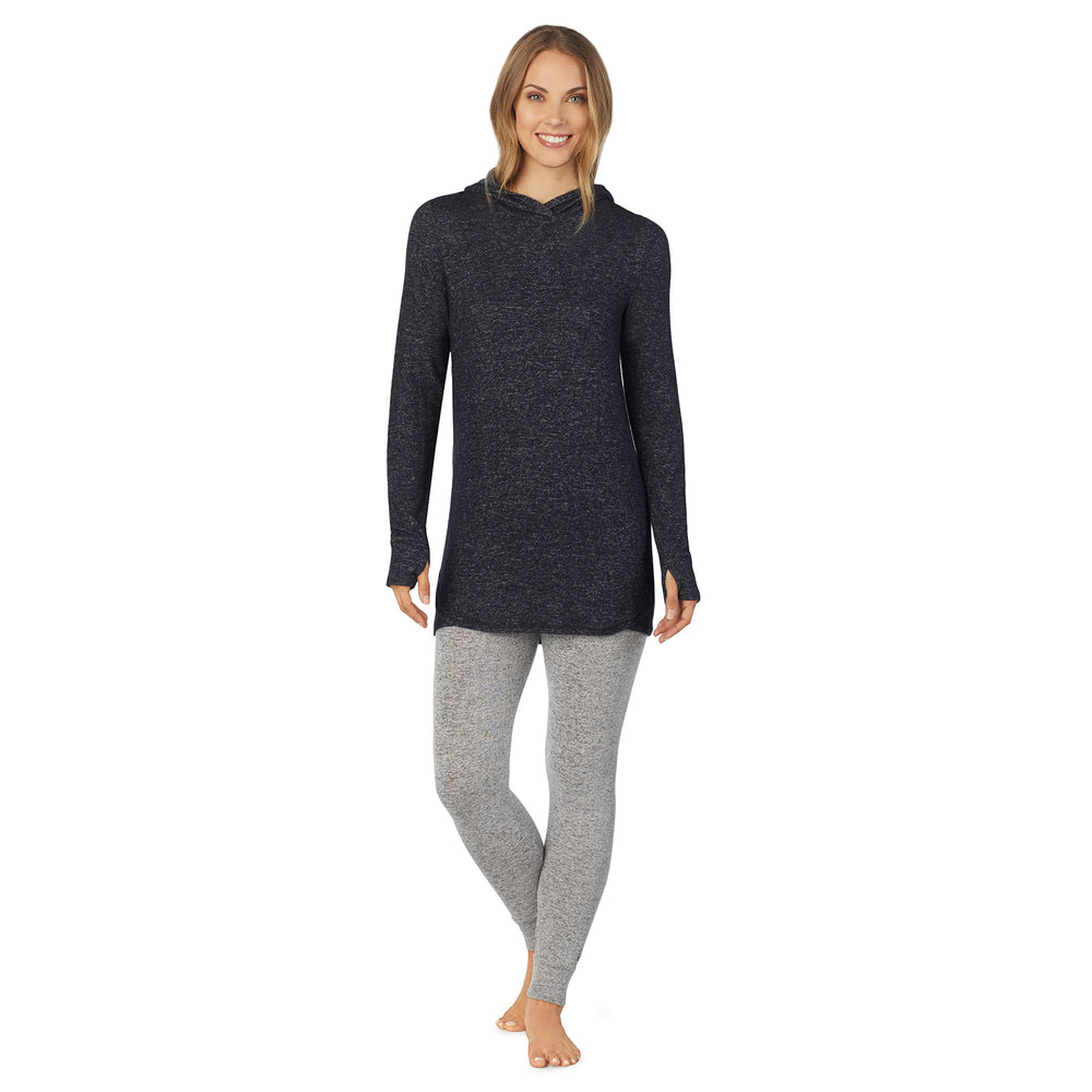 A lady wearing a marled dark charcoal long sleeve tunic hoodie.