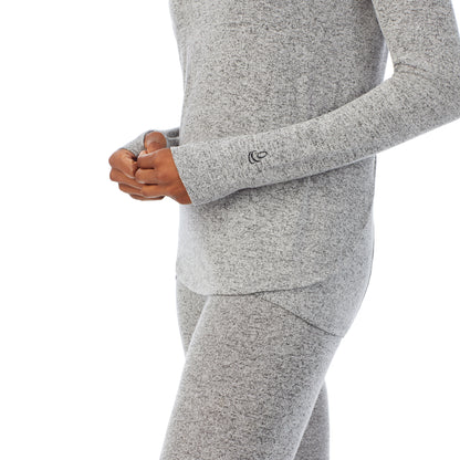 Marled Grey; Model is wearing size S. She is 5’10”, Bust 34”, Waist 24”, Hips 34”. @A lady wearing a marled grey long sleeve tunic hoodie.
