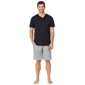  A lady wearingMens Short Sleeve Crew Neck Top and Pant Pajama Set with Navy Sea Life print