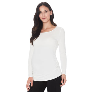 A lady wearing a ivory long sleeve maternity ballet neck top. #Model is wearing a maternity bump.