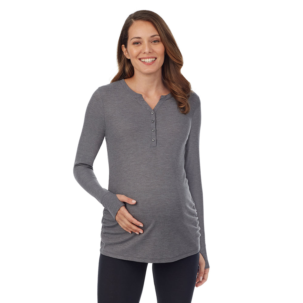 A lady wearingUltra Cozy Maternity Long Sleeve Funnel Neck Tunic with Olive Moss Heather print