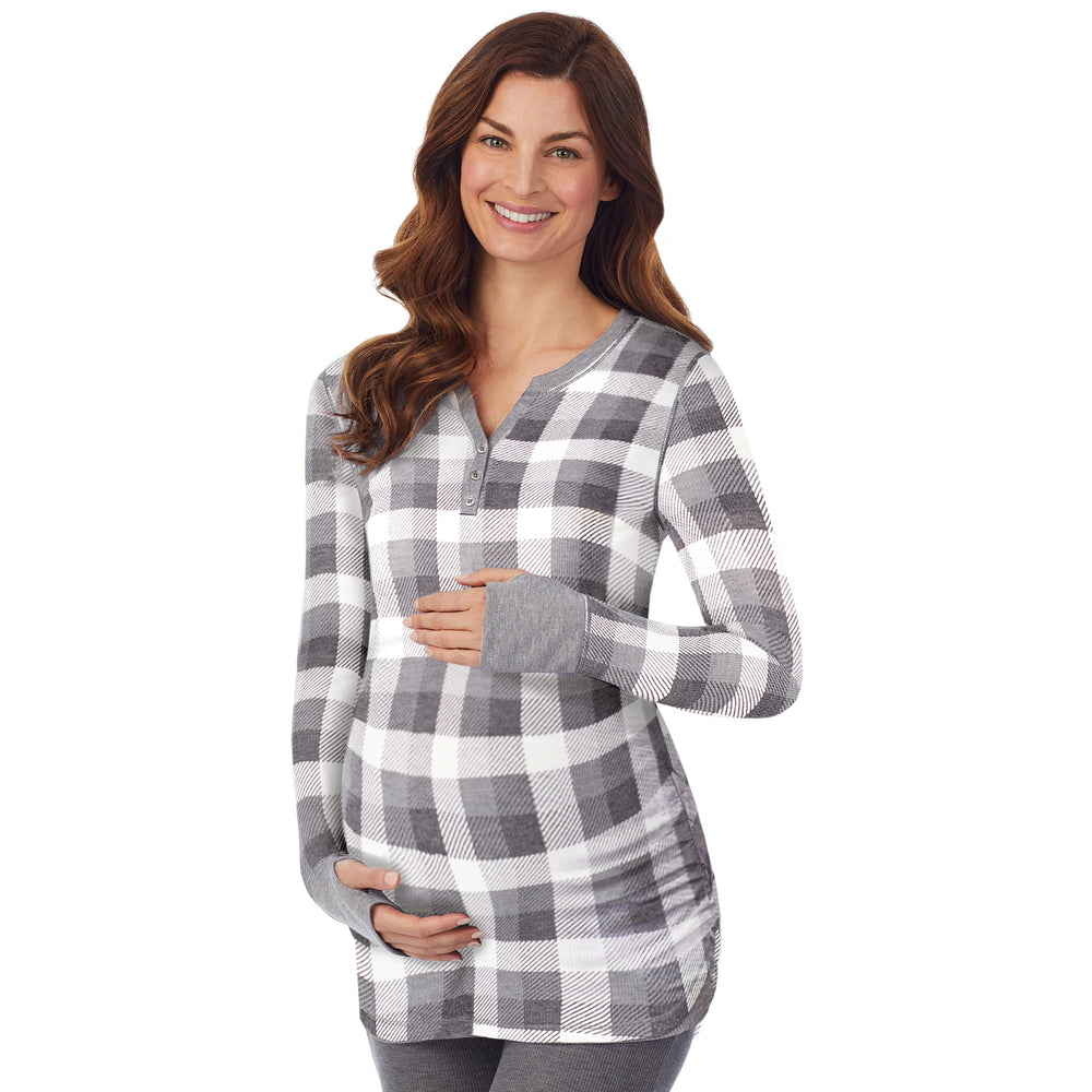 A lady wearing a grey buffalo check long sleeve split V-Neck henley. #Model is wearing a maternity bump.