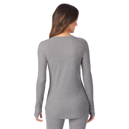 Stone Grey Heather; 'Model is wearing size S. She is 5’9”, Bust 32”, Waist 25”, Hips 35”. @A lady wearing a stone grey heather long sleeve split V-Neck.