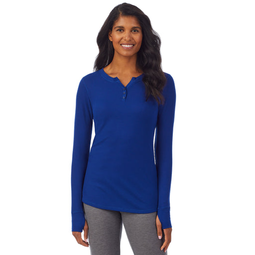 Royal Blue; 'Model is wearing size S. She is 5’10”, Bust 34”, Waist 24”, Hips 34”. @A lady wearing a royal blue long sleeve split V-Neck.