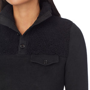 upper body of a lady wearing black long sleeve mixed media mock !59% Polyester, 35% Recycled Polyester, 6% Spandex!