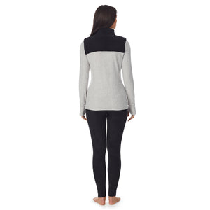 a lady wearing grey long sleeve mixed media mock !59% Polyester, 35% Recycled Polyester, 6% Spandex!