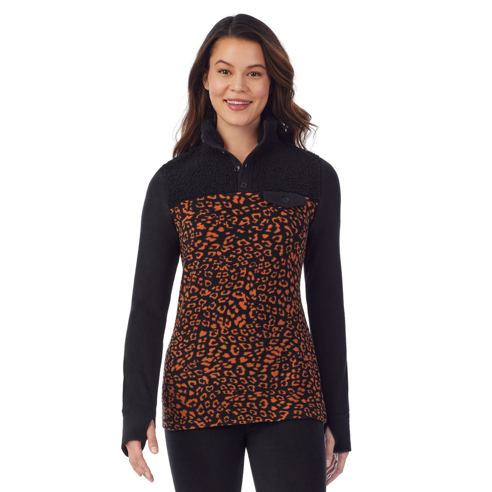 upper body of a lady wearing amber animal long sleeve mixed media mock !59% Polyester, 35% Recycled Polyester, 6% Spandex!