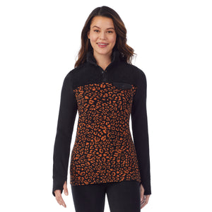 upper body of a lady wearing amber animal long sleeve mixed media mock !59% Polyester, 35% Recycled Polyester, 6% Spandex!