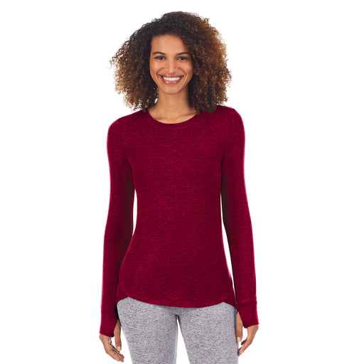 A lady wearing marled deep red softknit long sleeve crew