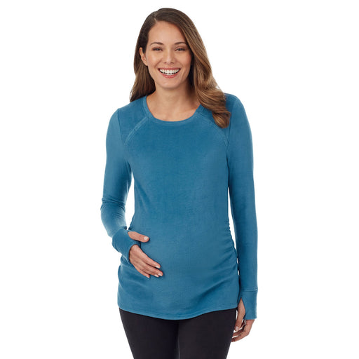 Vintage Blue;Model is wearing a size S. She is 5’10”, Bust 34”, Waist 34”, Hips 40”.@A lady wearing long sleeve fleecewear with stretch maternity snap front crew.#Model is wearing a maternity bump.