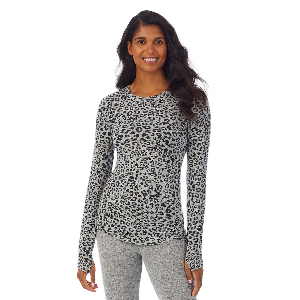 A lady wearing a grey animal  long sleeve crew.