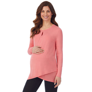A lady wearing a bright coral long sleeve maternity wrap front top. #Model is wearing a maternity bump.