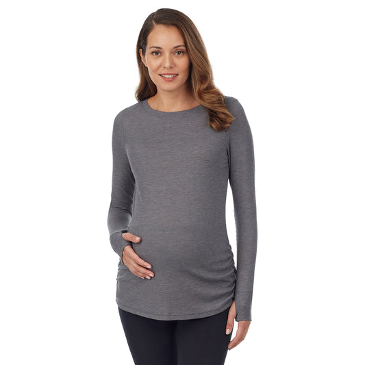 A lady wearing a stone grey heather long sleeve maternity ballet neck top. #Model is wearing a maternity bump.