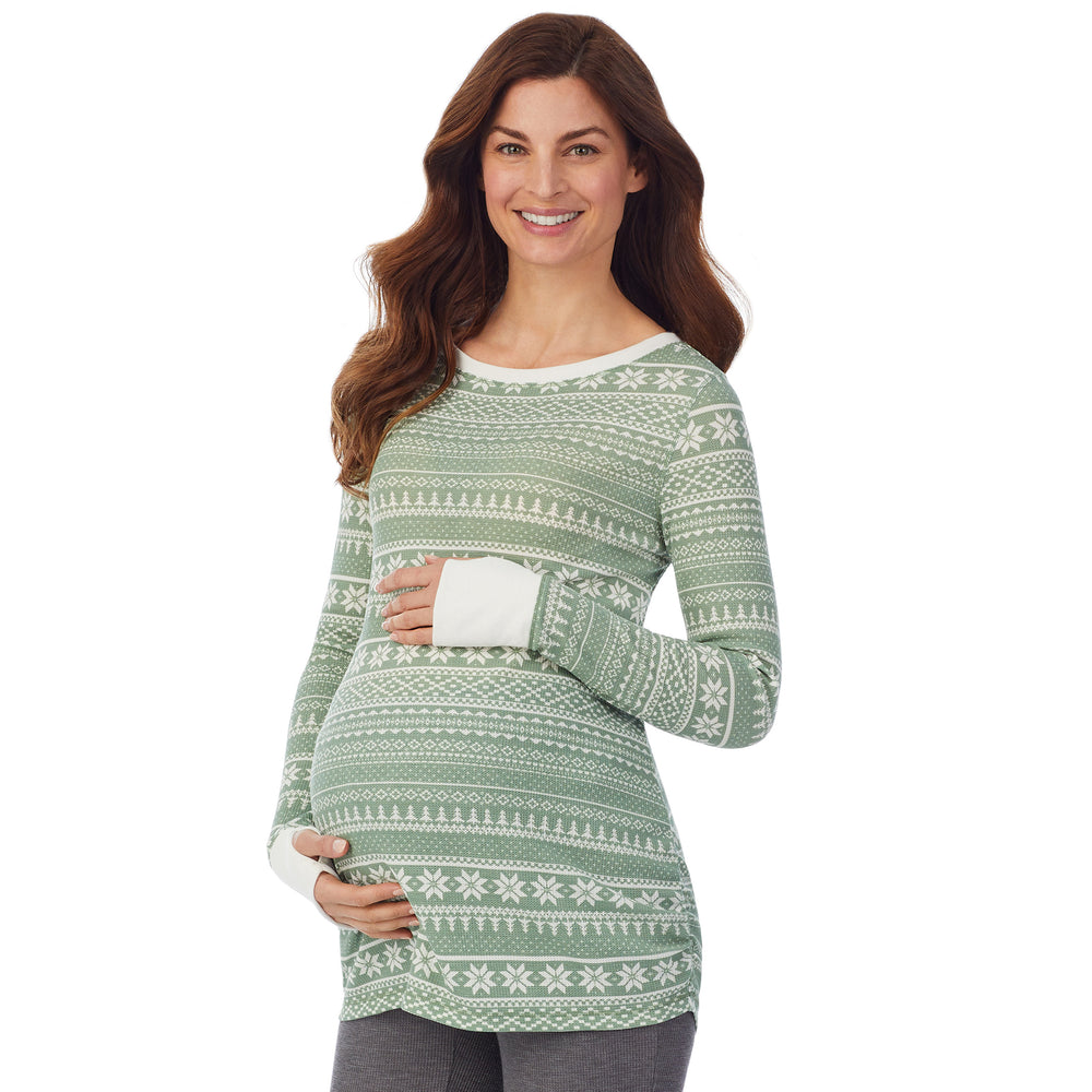 A lady wearing a seagrass fairisle long sleeve maternity ballet neck top. #Model is wearing a maternity bump.