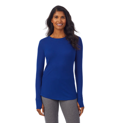 Royal Blue; Model is wearing size S. She is 5’10”, Bust 34”, Waist 24”, Hips 34”. @A lady wearing a royal blue long sleeve crew.