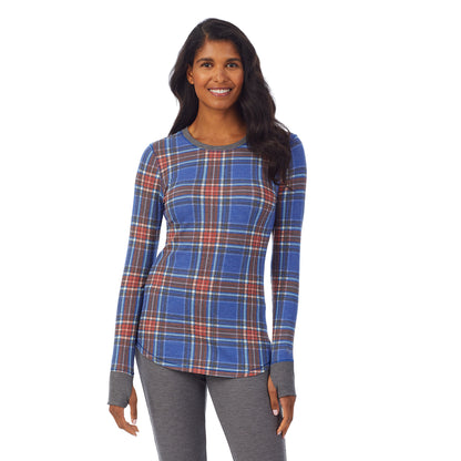 Red Blue Plaid; Model is wearing size S. She is 5’10”, Bust 34”, Waist 24”, Hips 34”. @A lady wearing a red blue plaid long sleeve crew.