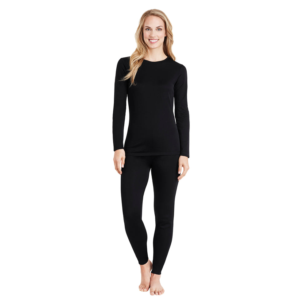 A lady wearing a black long sleeve crew.