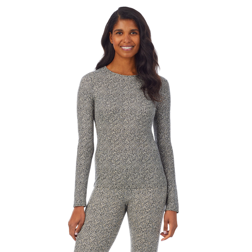 A lady wearing a cheetah long sleeve crew.